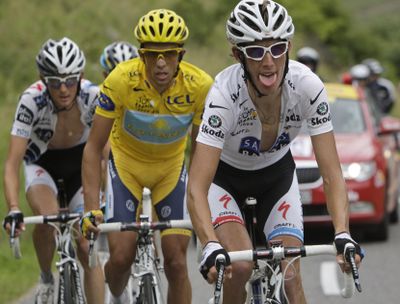 Overall leader Alberto Contador, center, climbs Colombiere pass during Wednesday’s 17th stage of the Tour de France with stage winner Frank Schleck, left, and Andy Schleck, right.  (Associated Press / The Spokesman-Review)