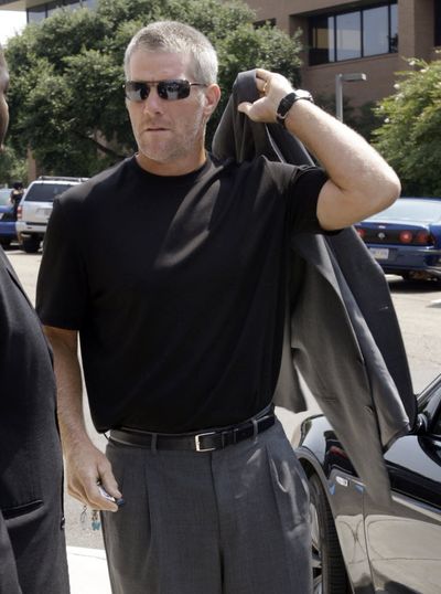 Brett Favre, shown in this July 11, 2009, image, is on his way to Minnesota to meet with the Vikings. Coach Brad Childress confirmed in an e-mail to Tuesday morning, Aug. 18, 2009, that the veteran quarterback was traveling from Mississippi to meet with the team. (Associated Press)