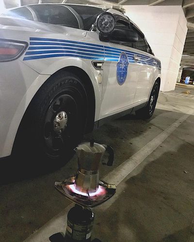 In this Saturday, Sept. 9, 2017 photo released by the Miami Police Department, a coffee pot sits on heat, in Miami. Some Miami Police officers remembered to pack an essential item in their hurricane survival pack: Cuban coffee, also known as cafecito. The police department tweeted a picture late Saturday showing a stovetop coffee maker atop a camp stove. (Miami Police Department / Associated Press)