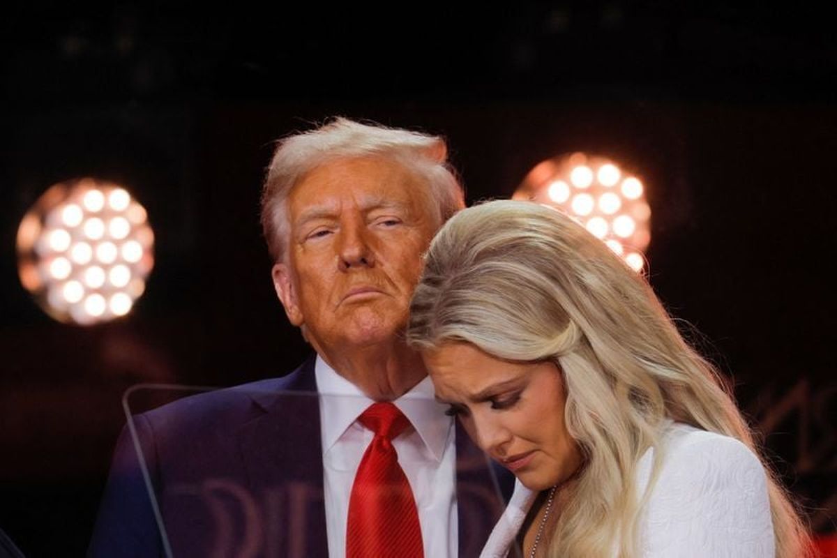 Erika Kirk, wife of slain conservative commentator Charlie Kirk and the new CEO of Turning Point USA, reacts next to U.S. President Donald Trump during a memorial service at State Farm Stadium, in Glendale, Arizona, U.S., Sunday.   (Reuters )