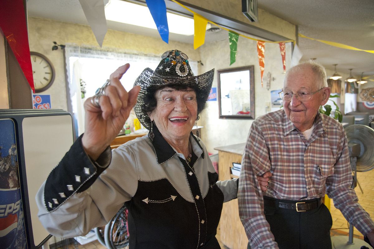 May Vidmar, 91, yodels for 100 year-old Harvey Schluter during a birthday celebration at the Hillside Inn, July 31. Aunt May proceeded the yodeling with a rendition of “Happy Birthday.” His actual birthday is July 2, but the café was closed that day. (Dan Pelle)