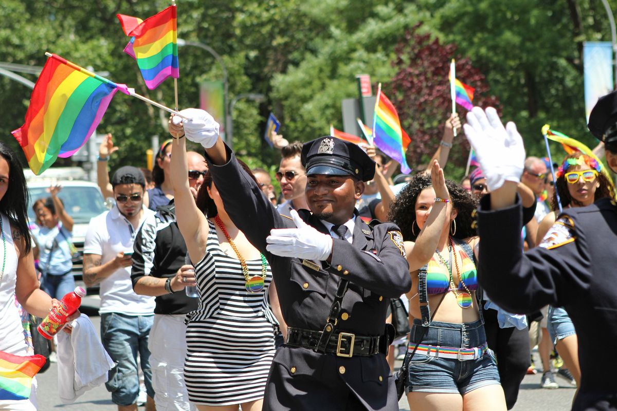 NYPD police officers march during New York’s 2014 gay pride parade. Organizers of the city’s Pride events said Saturday they are banning police and other law enforcement from marching in their annual parade.  (Julia Weeks)