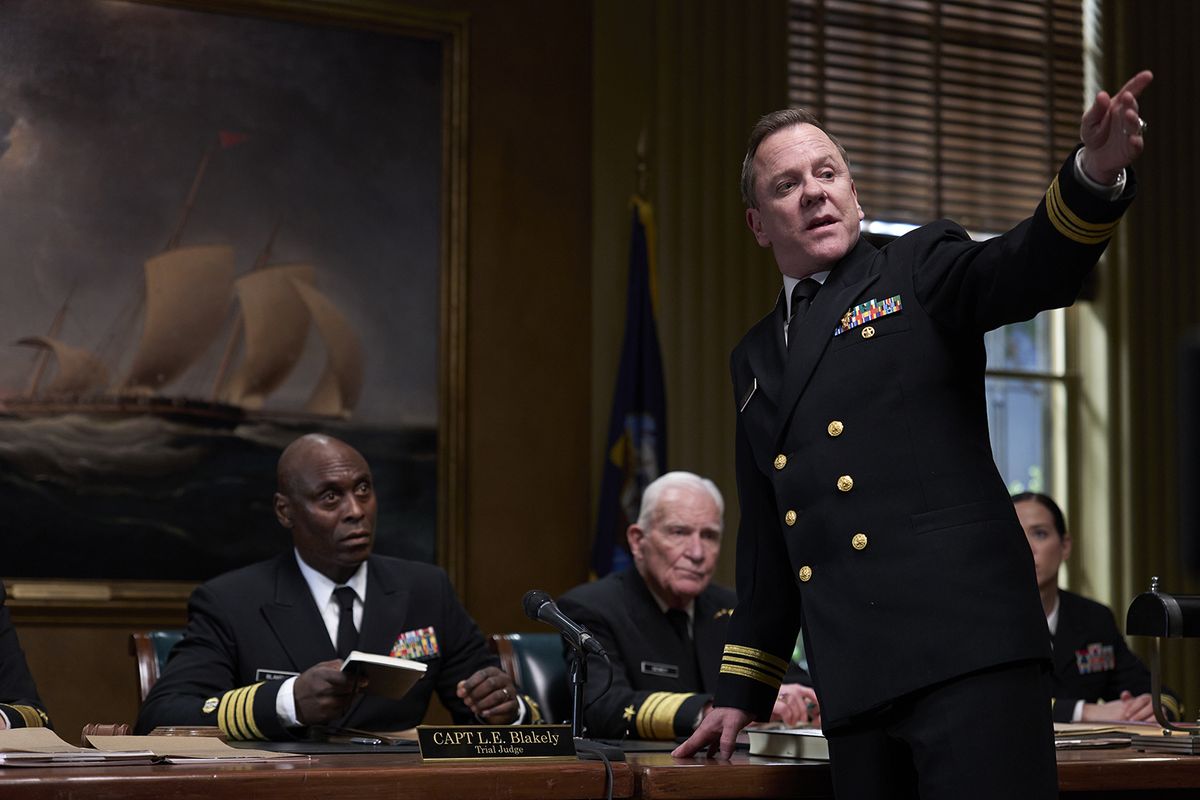 Lance Reddick, left, and Kiefer Sutherland, standing, in the movie “The Caine Mutiny Court-Martial.”  (Showtime)