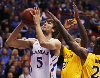 Kansas center Jeff Withey finished with 13 points, 13 rebounds and nine blocks in the Jayhawks’ 88-80 win over Long Beach State. (Associated Press)