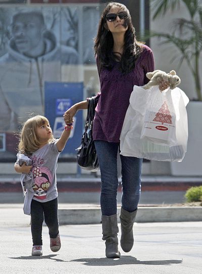 In this Sept. 29, 2011 file photo, a woman and child leave a mall with purchases in Culver City, Calif. Consumers' confidence in the economy fell in October to the lowest it's been since 2009 when the U.S. was in the middle of a deep recession, according to a report released Tuesday, Oct. 25, 2011, by a private research group. (AP Photo/Reed Saxon, File)
