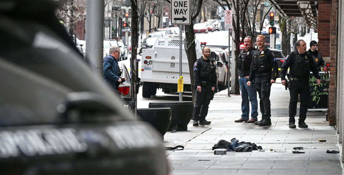 Police on the scene of police shooting on Howard Street, Monday, Feb. 12, 2024, in downtown Spokane. (DAN PELLE/THE SPOKESMAN-REVIEW)