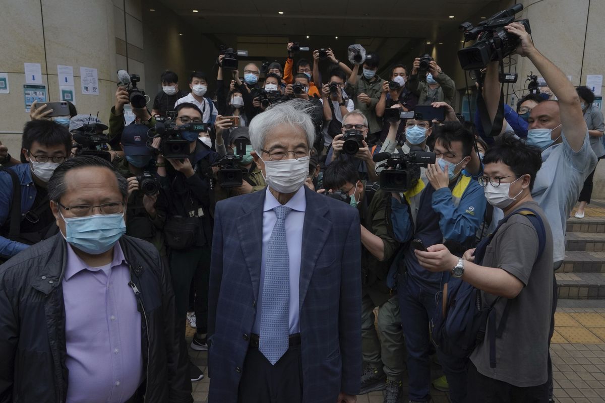 Pro-democracy activists Martin Lee, center, and Albert Ho, left, arrive at a court in Hong Kong Friday, April 16, 2021. Seven of Hong Kong’s leading pro-democracy advocates, including Lee and pro-democracy media tycoon Jimmy Lai, are expected to be sentenced Friday for organizing a march during the 2019 anti-government protests that triggered an overwhelming crackdown from Beijing.  (Kin Cheung/Associated Press)