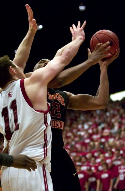 Taj Gibson (with ball) helped USC to victory in Pullman last month.  (Associated Press / The Spokesman-Review)