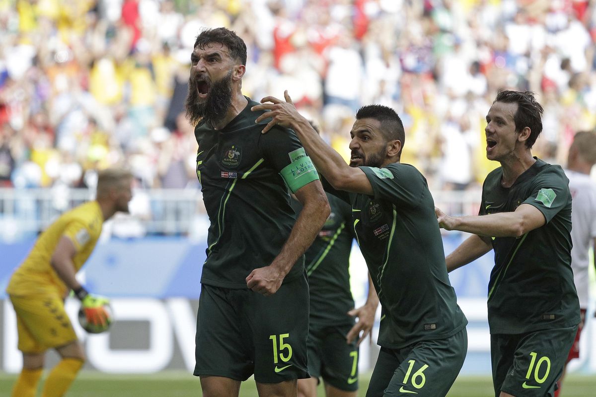 Australia’s Mile Jedinak celebrates scoring his side’s opening goal during the Group C match between Denmark and Australia at the 2018 soccer World Cup in the Samara Arena in Samara, Russia, Thursday, June 21, 2018. (Gregorio Borgia / Associated Press)