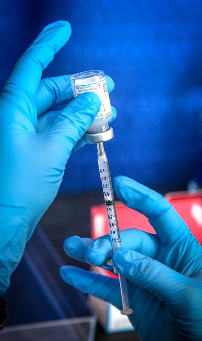 A syringe is filled with .05 mm of Moderna vaccine, Friday, April 2, 2021 at the Spokane Arena. (DAN PELLE/THE SPOKESMAN-REVIEW)