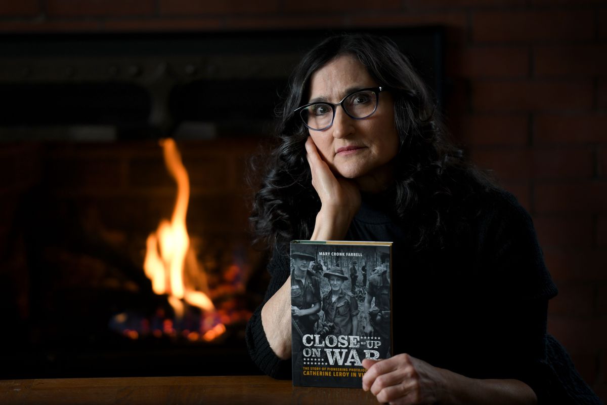 Mary Cronk Farrell, author of “Close-Up on War: The Story of Pioneering Photojournalist Catherine Leroy in Vietnam,” a book about Leroy’s time at work during the Vietnam War, is photographed near her home in Spokane on Tuesday.  (Kathy Plonka/The Spokesman-Review)