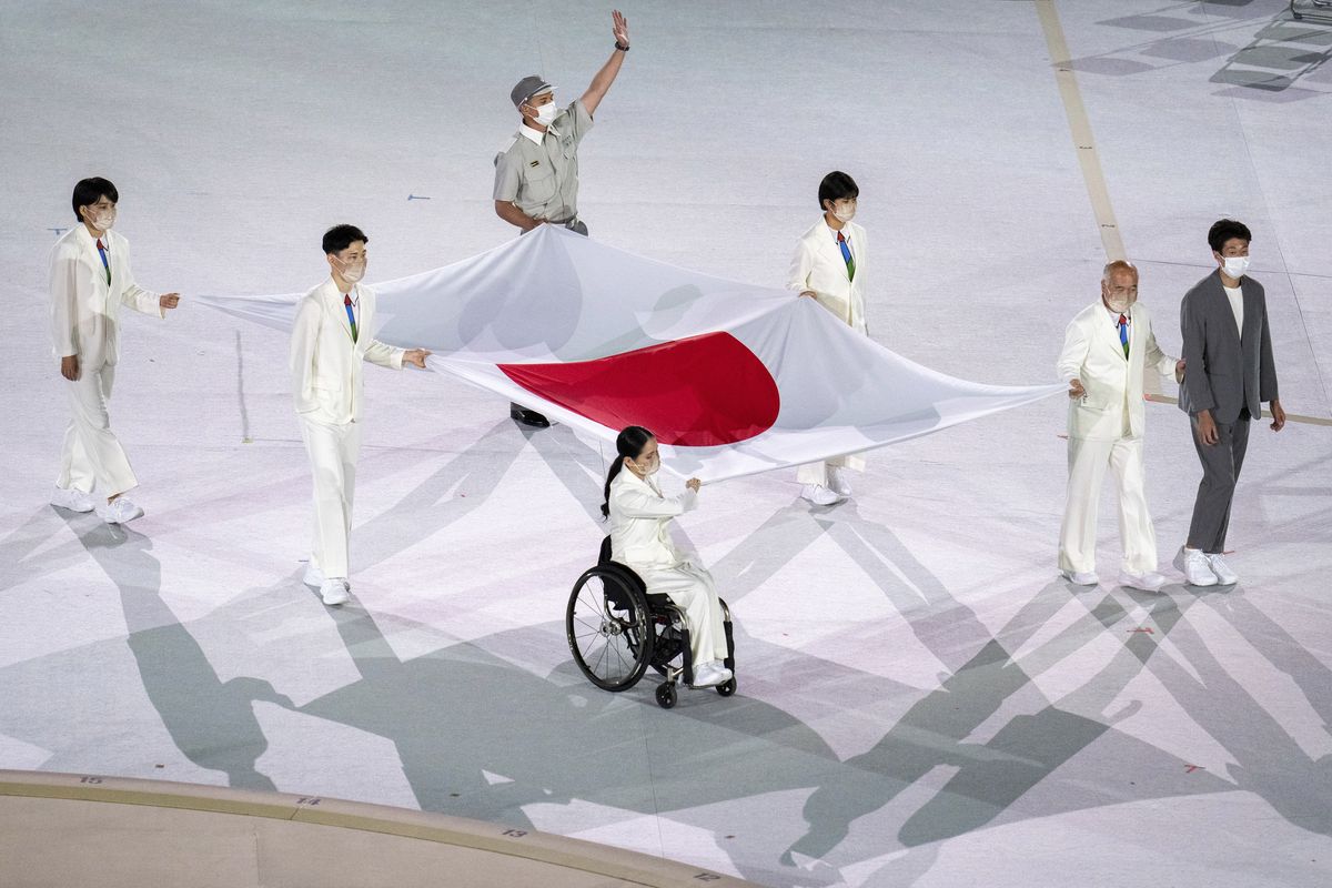 Athletes from Japan Miki Matheson, Mineho Ozaki, Taiyou Imai, Erina Yuguchi, Kaori Icho, and Tskumi Asatani carry the national flag of Japan into the Olympic Stadium at the start of the Paralympic Opening Ceremony Tokyo 2020 Paralympic Games in Tokyo, Tuesday, Aug. 24, 2021.  (Joe Toth)