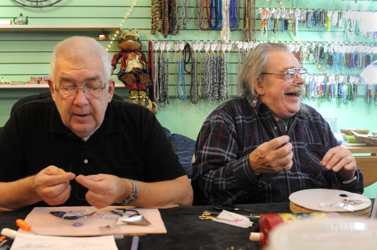 Rocky Corisis, left, and Marvin Schmuck work on projects at Bead Addict’s Attic. (Jesse Tinsley / The Spokesman-Review)