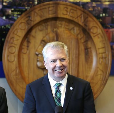 Seattle Mayor Ed Murray holds a news conference Thursday on a proposal to increase the minimum wage in the city. (Associated Press)