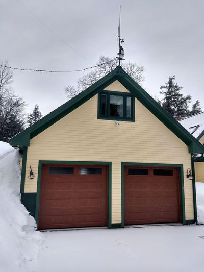 Detached garages come in all shapes and sizes. Don’t make yours too small like this one. Note the room over the garage because attic trusses were used. (Tim Carter)