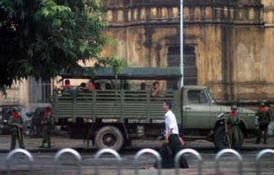 
Soldiers are deployed along the street leading to Sule Pagoda, a site of earlier unrest, in Yangon, Myanmar, on Monday. Associated Press
 (Associated Press / The Spokesman-Review)
