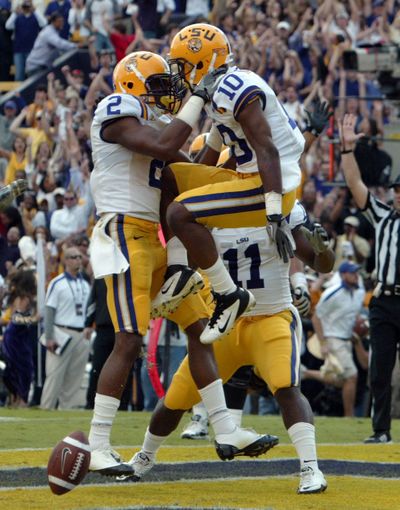 Rueben Randle, left, celebrates with Russell Shepard, whose TD reception gave LSU the lead for good. (Associated Press)
