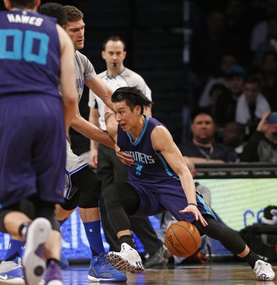 Charlotte guard Jeremy Lin has picked up his game and the Hornets are closing in on the Heat for the third seed in the Eastern Conference. (Kathy Willens / Associated Press)