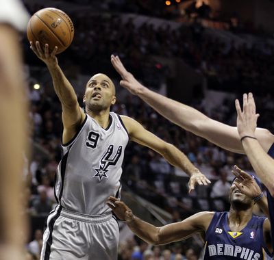 Tony Parker scores two of his 15 points in the Spurs’ Game 2 victory over the Grizzlies. (Associated Press)
