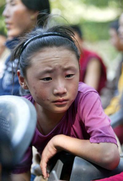 
Deckyi Paljom, 7, is one of 41 Tibetan refugees who survived an attack by Chinese border guards and reached India.
 (Associated Press / The Spokesman-Review)