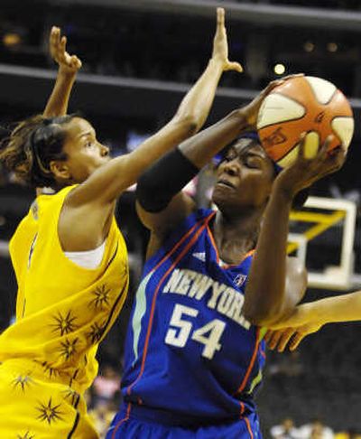 
New York Liberty's Barbara Farris is guarded tightly by Los Angeles Sparks' Keisha Brown on Friday. Associated Press
 (Associated Press / The Spokesman-Review)