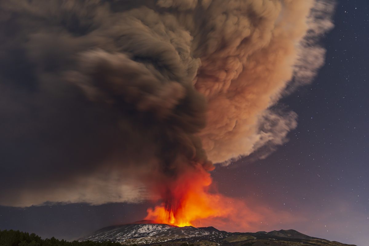 Smoke billows from the Mt. Etna volcano, as seen from Nicolosi, Sicily, southern Italy, Thursday, Feb. 10, 2022.  (Salvatore Allegra)