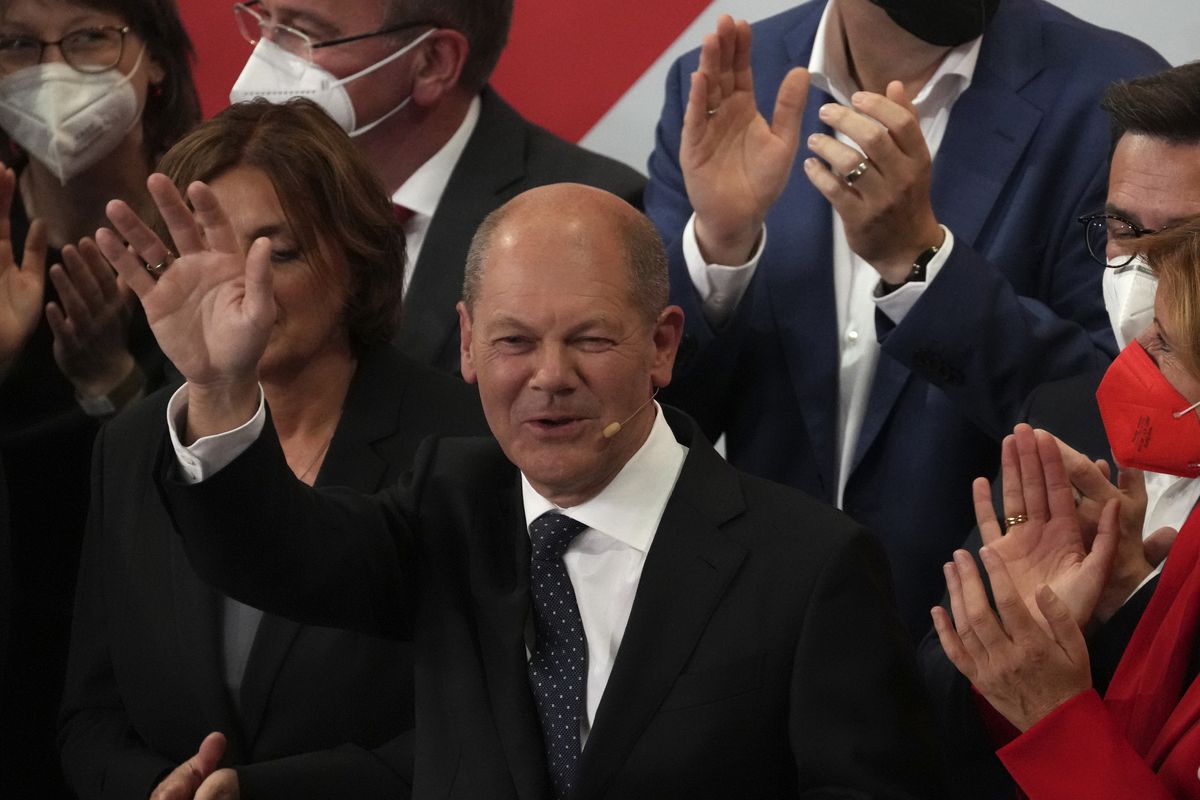 Olaf Scholz, Finance Minister and SPD candidate for Chancellor waves to his supporters after German parliament election at the Social Democratic Party, SPD, headquarters in Berlin, Sunday, Sept. 26, 2021.  (Michael Sohn)