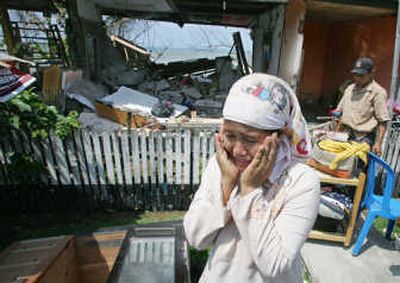
An Indonesian woman weeps outside her house in Lais, which was destroyed by an earthquake. Associated Press
 (Associated Press / The Spokesman-Review)