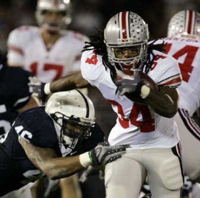 
Ohio State's Maurice Wells, right, rushes past Penn State's Tyrell Sales during Saturday's game. Associated Press
 (Associated Press / The Spokesman-Review)