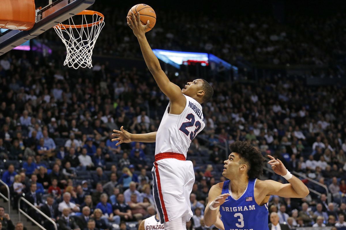 Gonzaga guard Zach Norvell Jr. (23) lays the ball up as BYU guard Elijah Bryant (3) looks on in the first half during an NCAA college basketball game Saturday, Feb. 24, 2018, in Provo, Utah. (Rick Bowmer / Associated Press)