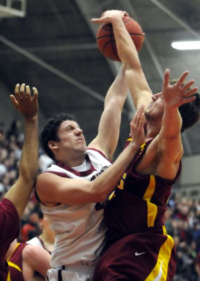 Whitworth’s Calvin Jurich, left, battles inside in Thursday’s tournament win over Claremont.  (Jesse Tinsley / The Spokesman-Review)