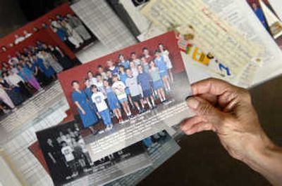 
Judy Indorf holds a photo of her third-grade students from the 1997-98 school year. Those students were scheduled to graduate high school this year. 
 (Holly Pickett / The Spokesman-Review)