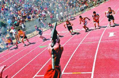 
Tom Parrish of Quincy pulls the trigger to start the 1,600-meter boys 1B final at EWU. Matt Cronrath of Odessa won the event. 
 (Jed Conklin / The Spokesman-Review)