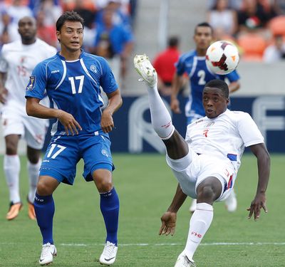 Haiti's Mechack Jerome, right, clears the ball away from Lester Blanco of El Salvador's during a CONCACAF Gold Cup match. (Associated Press)