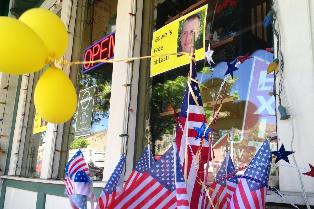 Flags and balloons decorate a storefront Wednesday in Hailey, Idaho, to celebrate Bowe Bergdahl’s eventual return. (Associated Press)