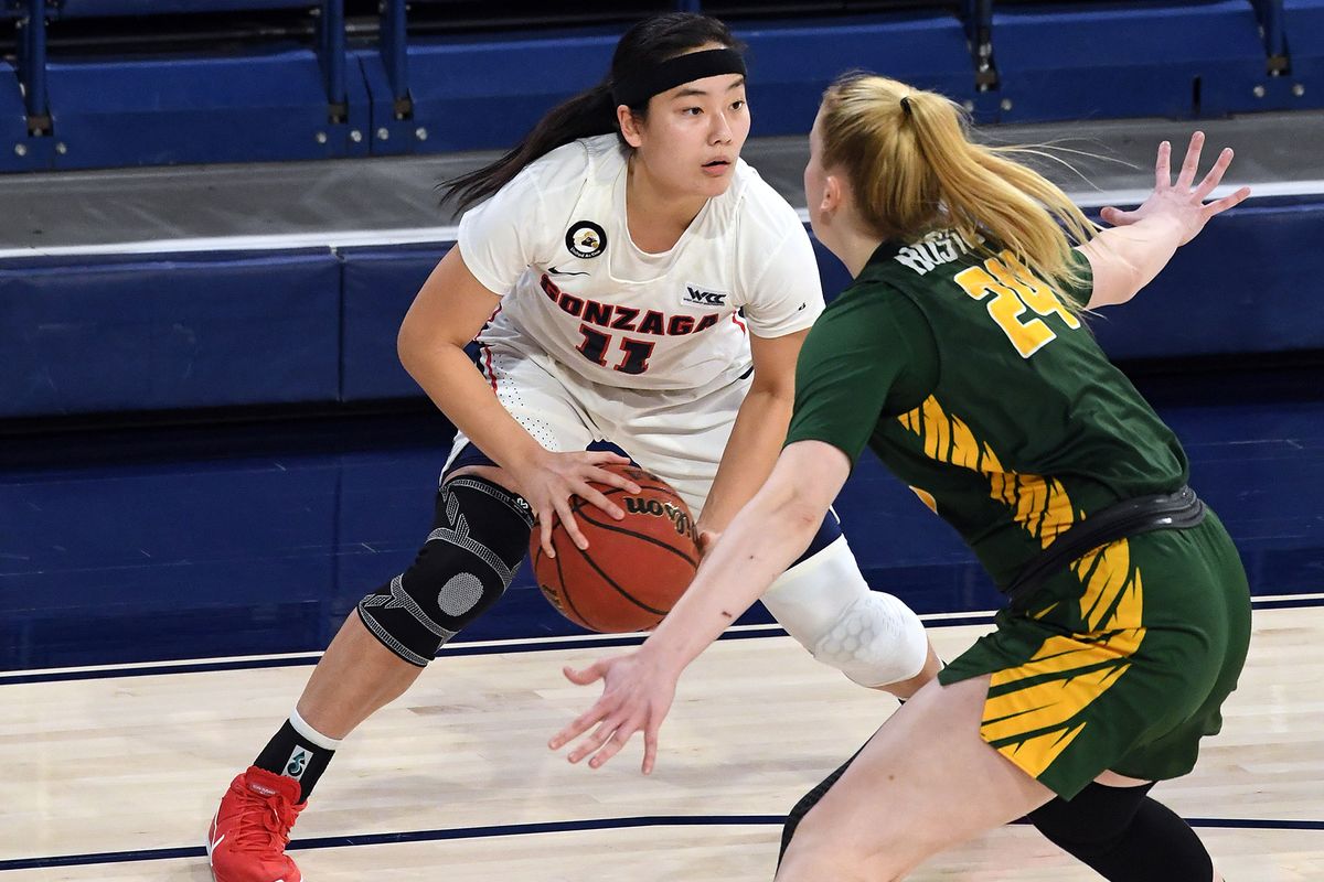 Gonzaga guard Kayleigh Truong looks to pass as San Francisco forward Lucija Kostic defends during the first half of the Bulldogs’ 79-66 home win Thursday.  (Colin Mulvany/THE SPOKESMAN-REVIEW)