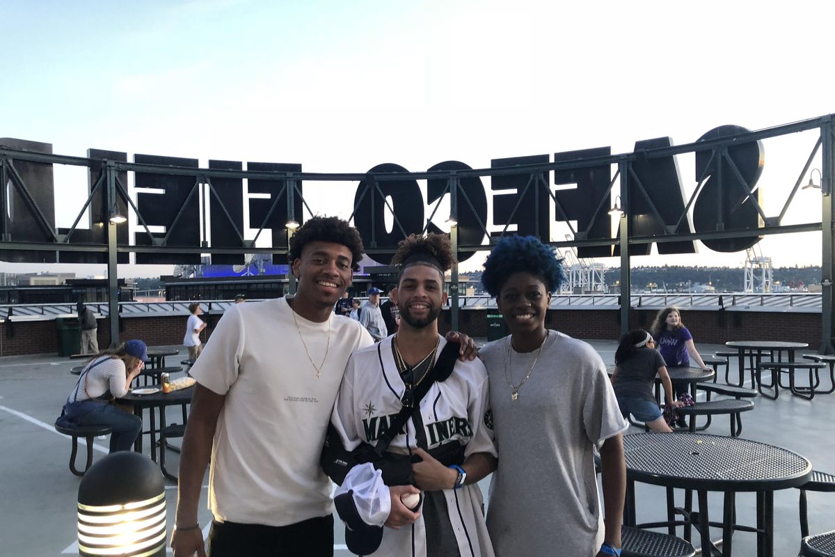 Gonzaga basketball players Jeremy Jones, left, Josh Perkins and Zykera Rice pose for a photo during a Seattle Mariners game on Saturday, June 2, 2018, in Seattle. (Robert Curley / The Spokesman-Review)