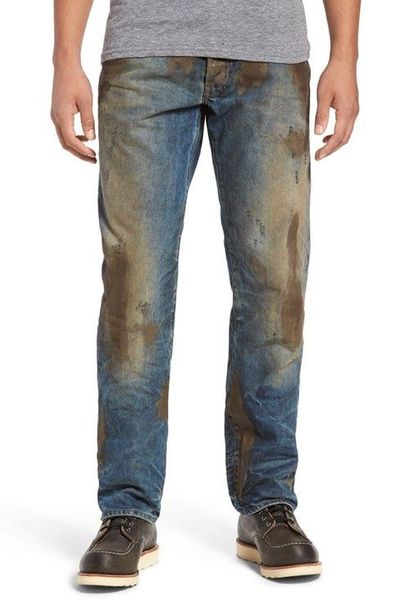 Nordstrom sells muddy-looking, “heavily distressed” jeans for $425 per pair. (Nordstrom)