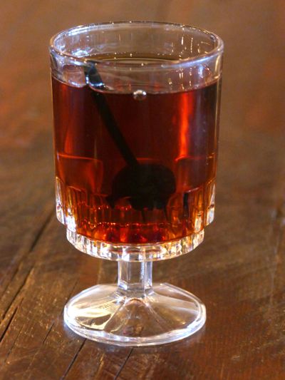 Cody Winfrey, bartender at Casper Fry in the Perry District, made his Winter Warmer, a cognac-based cocktail, which he describes as a marriage between a Negroni and a Manhatttan. (Jesse Tinsley / The Spokesman-Review)