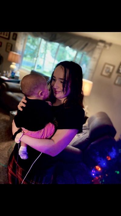 Kaylee Guerena of Aspire High School, shown holding her daughter, will pursue a career as a pediatric certified nursing assistant.  (Courtesy )