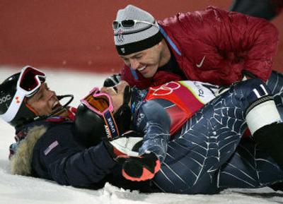 
American Ted Ligety, center, gets snowed under by teammates as he celebrates his gold medal in the men's combined at the Turin Winter Olympic Games.
 (Associated Press / The Spokesman-Review)