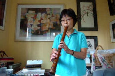 
Water-media and silk artist Olivia Waterman is learning to play the shakuhachi, a traditional Japanese flute.
 (Photos by DAN PELLE/ / The Spokesman-Review)