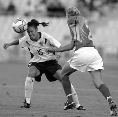USA's Kate Markgraf, left, fights for the ball with Australia's Rhian Davies during the women's group G soccer match  Tuesday. 
 (Associated Press / The Spokesman-Review)