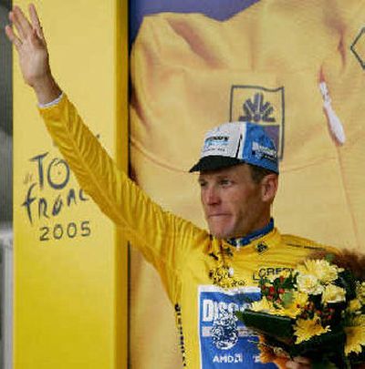 
Six-time Tour de France winner Lance Armstrong celebrates yellow jersey. 
 (Associated Press / The Spokesman-Review)