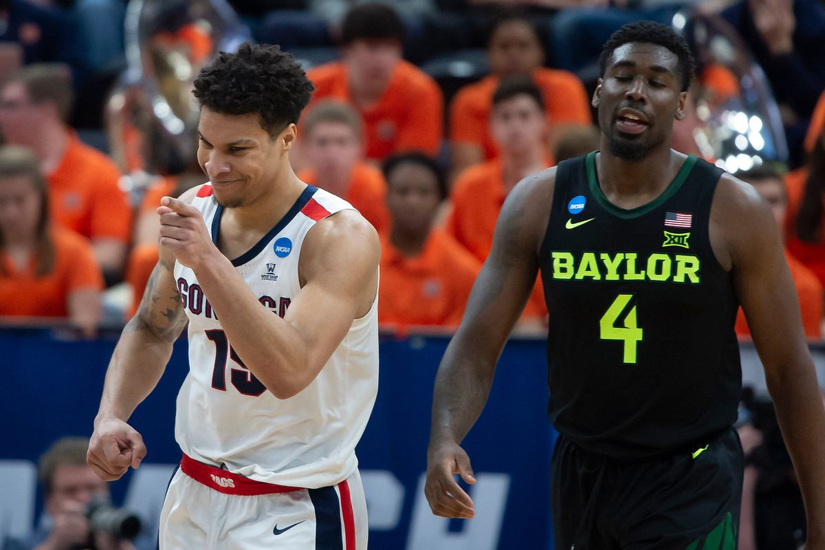 Gonzaga’s Brandon Clarke acknowledges teammate Rui Hachimura after he assisted on Clarke’s basket in a 2019 NCAA Tournament second-round win over Baylor in Salt Lake City.  (Colin Mulvany/The Spokesman-Review)