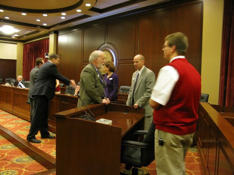 Before start of immigration hearing in Senate State Affairs Committee on Monday morning, lawmakers and advocates greet committee members. (Betsy Russell)