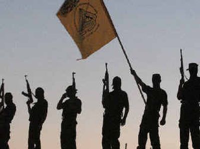 
Palestinian militants of the Al-Aqsa Martyrs Brigade, a militia linked to Yasser Arafat's Fatah movement, raise their rifles during a demonstration decrying the new appointments.  Palestinian militants of the Al-Aqsa Martyrs Brigade, a militia linked to Yasser Arafat's Fatah movement, raise their rifles during a demonstration decrying the new appointments.  
 (Associated PressAssociated Press / The Spokesman-Review)
