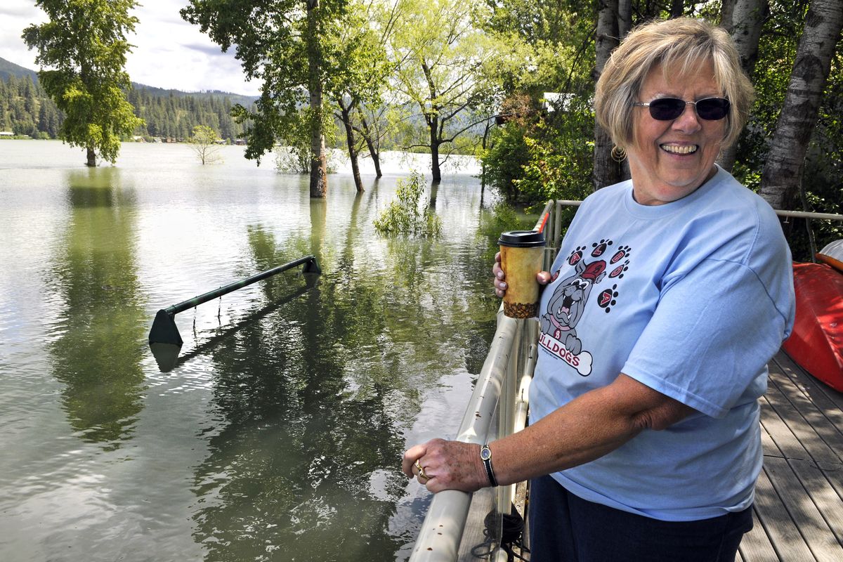 Cj Lockhart, a Spokane resident, made a trip to the Newport, Wash., area Tuesday to check on her daughter’s home along the flooded Pend Oreille River. Lockhart found a swing set almost completely underwater. (Dan Pelle)