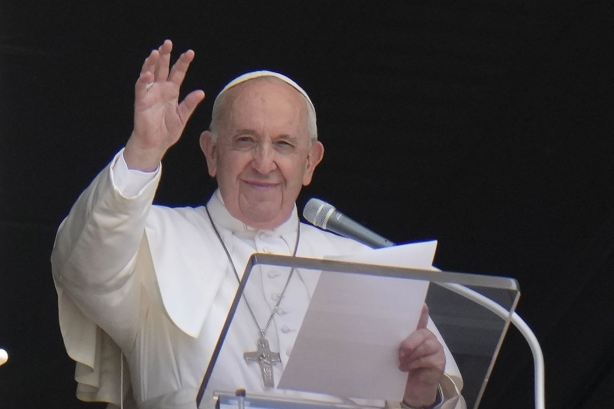 FILE - In this Sunday, July 4, 2021 file photo, Pope Francis waves to the crowd as he arrives to recite the Angelus noon prayer from the window of his studio overlooking St.Peter