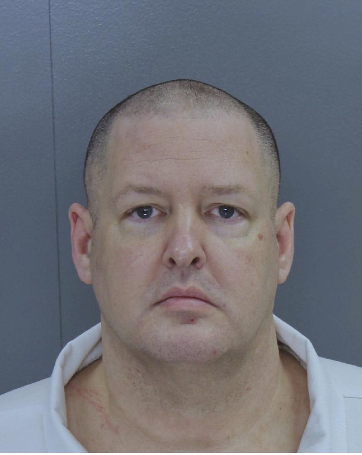This photo provided by South Carolina state shows Todd Kohlhepp. New investigative videos released by prosecutors show the dramatic rescue of a woman who had been chained inside a metal storage container for about two months by Kohlhepp. The videos also show Kohlhepp confessing to killing seven people in South Carolina. He pleaded guilty two weeks ago to avoid the death penalty and was sentenced to life in prison. On Friday, prosecutors released several videos, dozens of pictures and hundreds of pages of evidence against him. (South Carolina state)